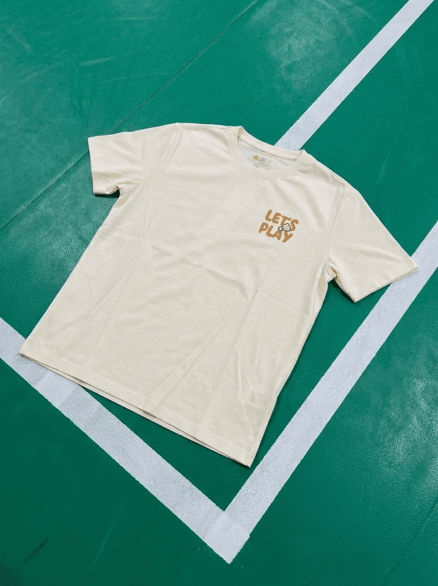 Let’s Play!” Quick Dry Badminton Tee – Otter Edition